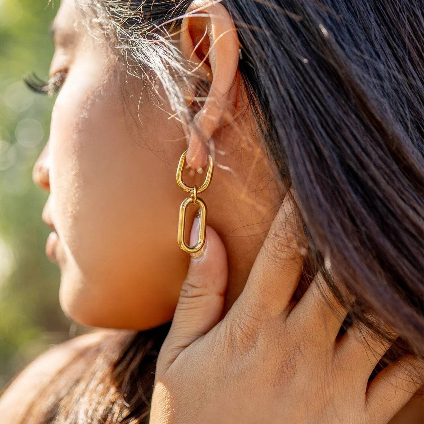 Model wearing gold convertible huggie dangle earrings – lightweight, waterproof, and nickel-free by Lauren Riley Jewelry