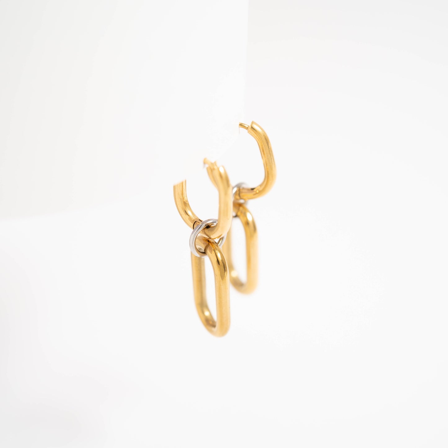 Close-up of mixed metal convertible huggie earrings with detachable links – modern waterproof hypoallergenic design by Lauren Riley Jewelry