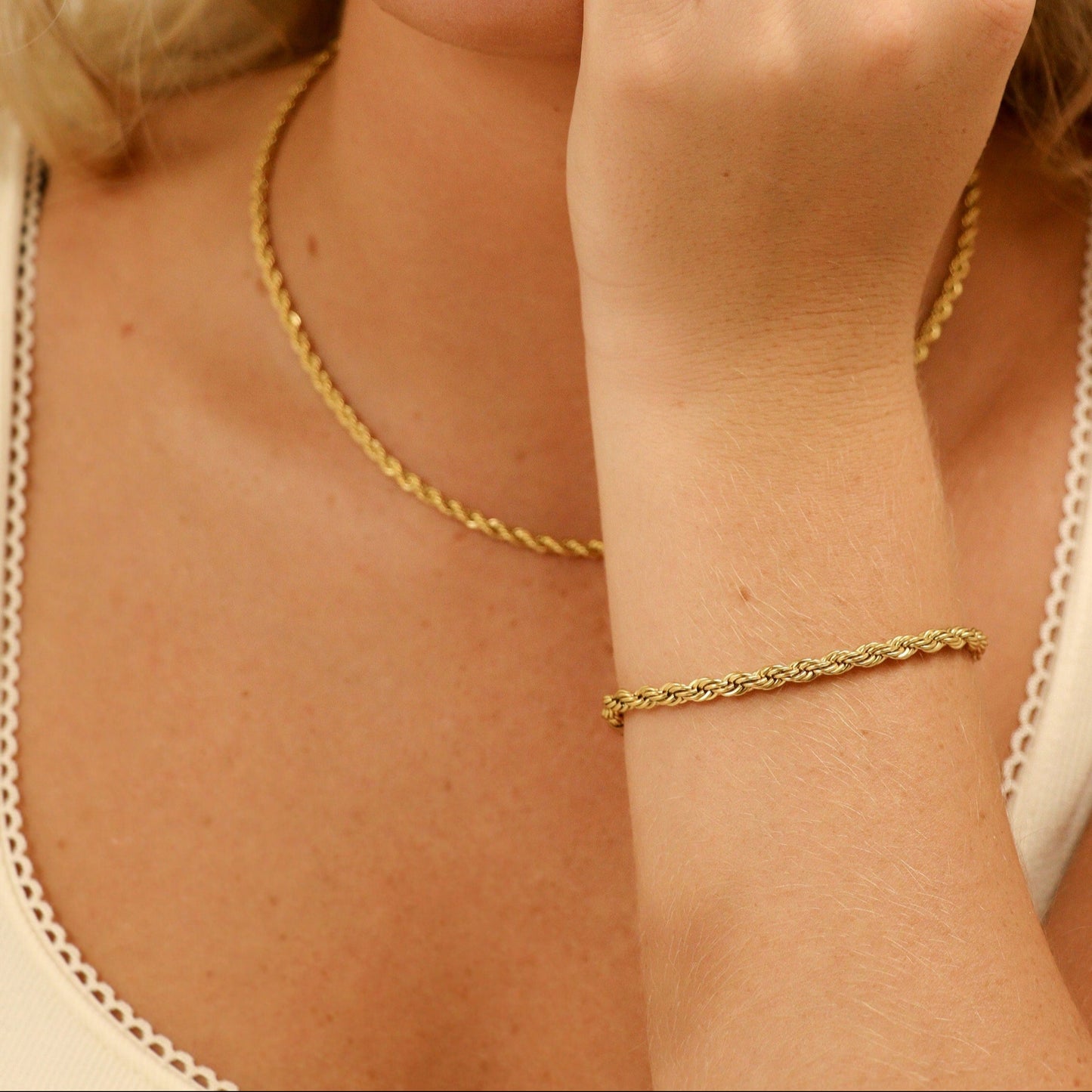 Model wearing matching gold rope chain bracelet and necklace set from Lauren Riley Jewelry – tarnish-resistant, hypoallergenic, waterproof 18k PVD jewelry.