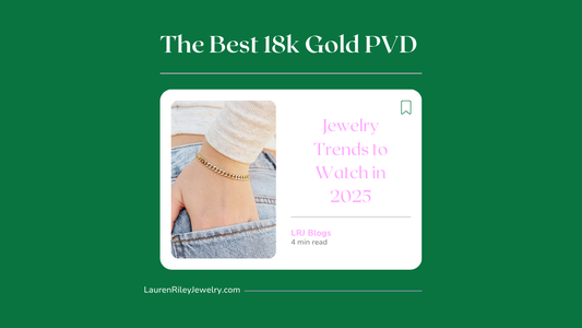 Close-up of a woman's wrist wearing a waterproof 18k gold PVD chain bracelet with denim and sweater – featured in Lauren Riley Jewelry's 2025 gold jewelry trends blog.