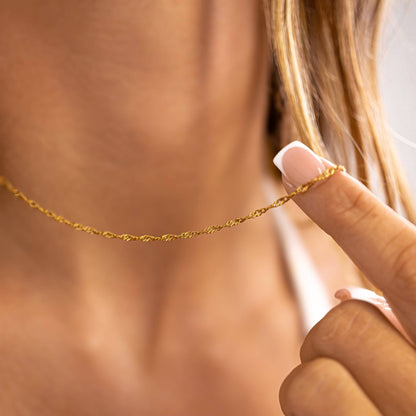 Close-up of gold Singapore chain necklace being held – waterproof tarnish-free jewelry by Lauren Riley Jewelry