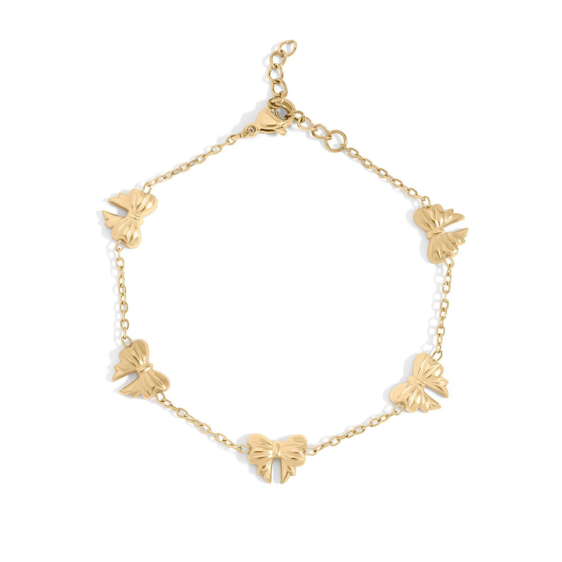 Gold bow charm bracelet made of waterproof, hypoallergenic 18k gold PVD stainless steel with dainty chain design – elegant and tarnish-resistant.