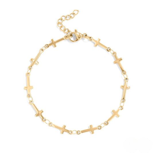 Dainty gold cross link bracelet with adjustable chain. Waterproof, hypoallergenic, and perfect for everyday wear or stacking with other bracelets.