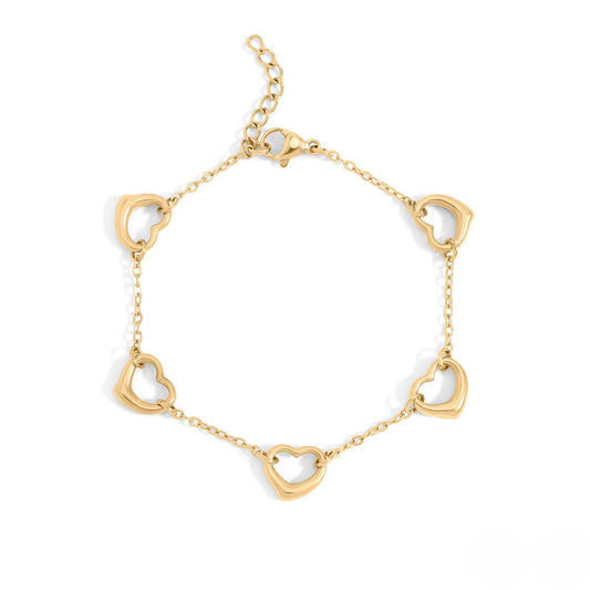 Gold heart charm bracelet featuring dainty open heart links, waterproof and hypoallergenic, perfect for layering or everyday wear.