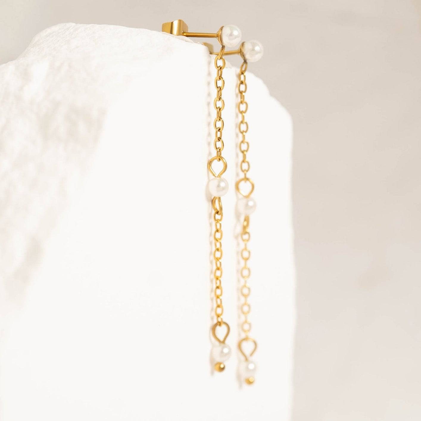Elegant gold heart chain drop earrings featuring delicate pearls – dainty and hypoallergenic jewelry perfect for weddings, dates, or everyday chic style.