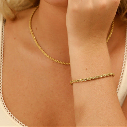 Model wearing matching gold rope chain bracelet and necklace set from Lauren Riley Jewelry – tarnish-resistant, hypoallergenic, waterproof 18k PVD jewelry.