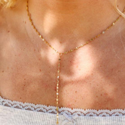 Gold Y-lariat necklace on model – dainty waterproof and tarnish-resistant stainless steel chain with delicate drop detail, ideal for layering and everyday elegance.