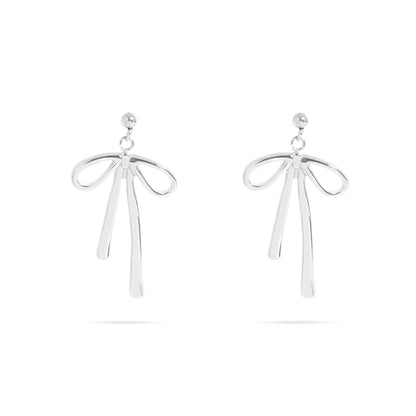 Pair of silver bow drop earrings with a delicate ribbon-inspired design on a white background. Hypoallergenic, tarnish-free, and waterproof earrings by Lauren Riley Jewelry.