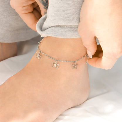 Woman wearing silver butterfly charm anklet on ankle – waterproof, hypoallergenic, dainty anklet for everyday or beach wear